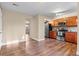This kitchen has stainless steel appliances, wooden cabinets, and wood flooring at 1272 S Crystal Way, Aurora, CO 80012