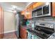 Well-lit kitchen with stainless steel appliances and granite countertops at 1272 S Crystal Way, Aurora, CO 80012