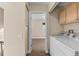 Convenient laundry area near a bedroom at 1272 S Crystal Way, Aurora, CO 80012