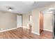 Living room with hardwood floors that leads to the bathroom and kitchen at 1272 S Crystal Way, Aurora, CO 80012