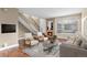 Inviting living room features a stone fireplace, comfortable seating, and a bright window at 1272 S Crystal Way, Aurora, CO 80012