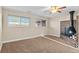 Main bedroom features a vintage fireplace, ceiling fan, and natural light at 1272 S Crystal Way, Aurora, CO 80012