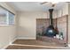 Main bedroom showcases a brick fireplace and ceiling fan for added comfort at 1272 S Crystal Way, Aurora, CO 80012