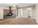 Inviting main bedroom with a unique fireplace, ceiling fan, and access to closets at 1272 S Crystal Way, Aurora, CO 80012
