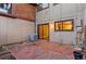 Brick patio area with wood fence, exterior of home, and sliding glass door at 1272 S Crystal Way, Aurora, CO 80012