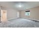 Spacious basement featuring neutral paint, plush carpet, and a window for natural light at 23993 E Briarwood Dr, Aurora, CO 80016