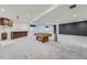 Finished basement with a custom wet bar and a billiard table at 23993 E Briarwood Dr, Aurora, CO 80016
