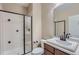 This bathroom has a walk-in shower, a toilet and a single vanity with neutral paint at 23993 E Briarwood Dr, Aurora, CO 80016