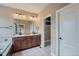 This bathroom has double sinks, a walk-in closet, and a large soaking tub at 23993 E Briarwood Dr, Aurora, CO 80016