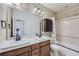 This bathroom has double sinks, a bathtub, a shower and tile flooring at 23993 E Briarwood Dr, Aurora, CO 80016
