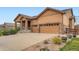 Charming single-Gathering home featuring a two-car garage, covered front porch, and drought resistant landscaping at 23993 E Briarwood Dr, Aurora, CO 80016