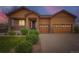 Charming two-story home with a well-manicured lawn and a spacious three-car garage at 23993 E Briarwood Dr, Aurora, CO 80016