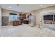 This kitchen features tile flooring, stainless steel appliances and access to a carpeted area at 23993 E Briarwood Dr, Aurora, CO 80016