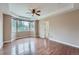 The main bedroom has large windows, tray ceilings, hardwood floors and plenty of space at 23993 E Briarwood Dr, Aurora, CO 80016