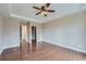 The main bedroom has hardwood floors, tray ceilings, and dual closets for ample storage space at 23993 E Briarwood Dr, Aurora, CO 80016