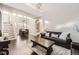 Bright living room features vaulted ceilings, staircase, and dark hardwood flooring at 7397 Red Fox Way, Littleton, CO 80125