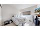 Cozy bedroom with neutral tones, a large window, and comfortable furnishings at 12604 Madison Way, Thornton, CO 80241