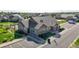 Aerial perspective of community clubhouse featuring an American flag and adjacent parking lot at 12604 Madison Way, Thornton, CO 80241