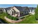 Charming home featuring a cozy front patio, well-maintained landscaping, and stone accents at 12604 Madison Way, Thornton, CO 80241