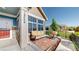 Cozy front porch featuring a comfortable seating area with stylish outdoor furniture at 12604 Madison Way, Thornton, CO 80241