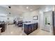 Bright kitchen with a breakfast bar island, stainless steel appliances and an adjacent dining area at 12604 Madison Way, Thornton, CO 80241