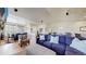 Open-concept living room with a large sectional sofa, providing ample space for comfortable living and entertaining at 12604 Madison Way, Thornton, CO 80241