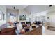 Spacious living area with fireplace, media center, and large sofa, perfect for relaxing and entertaining at 12604 Madison Way, Thornton, CO 80241
