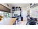 Spacious home office with built-in shelving, ample natural light, and modern decor at 12604 Madison Way, Thornton, CO 80241