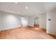 Spacious room with beautiful hardwood floors and natural light, ready for your personal touch at 7382 E Bates Dr, Denver, CO 80231