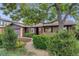 Beautiful home featuring mature landscaping, lush green bushes, and a picturesque curb appeal at 7382 E Bates Dr, Denver, CO 80231