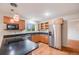 Kitchen features stainless steel appliances, wooden cabinets, and an eat-in countertop at 7382 E Bates Dr, Denver, CO 80231