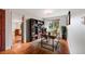 Well-lit home office featuring a large window, modern desk, and ample shelving at 7382 E Bates Dr, Denver, CO 80231