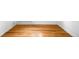 Spacious bedroom boasting gleaming hardwood floors, white walls and trim at 1168 Kearney St, Denver, CO 80220