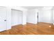 Spacious bedroom with hardwood floors, fresh white paint, and ample closet space at 1168 Kearney St, Denver, CO 80220