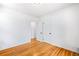 Bright room with hardwood floors, white trim and walls and an open closet at 1168 Kearney St, Denver, CO 80220
