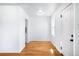 Bright entryway featuring refinished hardwood floors, freshly painted walls and new windows at 1168 Kearney St, Denver, CO 80220