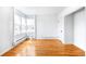 Bright living room featuring hardwood floors, large windows, and neutral paint for a modern aesthetic at 1168 Kearney St, Denver, CO 80220