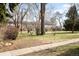 Large lawn and landscaping that surrounds the red brick building at 1168 Kearney St, Denver, CO 80220