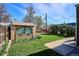 Lush backyard with a charming brick outbuilding and well-maintained lawn at 3051 W 39Th Ave, Denver, CO 80211