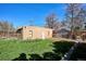 Large backyard featuring a detached brick building and a well-maintained lawn, offering plenty of space at 3051 W 39Th Ave, Denver, CO 80211