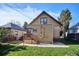 Backyard featuring a grassy area, deck with stairs, wood exterior of the home at 3051 W 39Th Ave, Denver, CO 80211