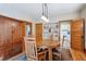 Inviting dining area features a round table, built-in cabinet, and doorway view into the adjacent kitchen at 3051 W 39Th Ave, Denver, CO 80211