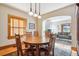 Warm dining area featuring hardwood floors, wood trim, and view to living area at 3051 W 39Th Ave, Denver, CO 80211