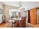 Comfortable dining room leads into a living room, offering a blend of space and warm ambiance at 3051 W 39Th Ave, Denver, CO 80211