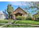 Charming home with mature trees, a manicured lawn, and inviting curb appeal at 3051 W 39Th Ave, Denver, CO 80211