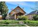 Charming home with mature landscaping, a manicured lawn and inviting curb appeal at 3051 W 39Th Ave, Denver, CO 80211