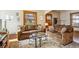 Inviting living room with cozy couches, decorative rug, and abundant natural light at 3051 W 39Th Ave, Denver, CO 80211