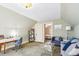 Relaxing living space with a desk, blue sofa, and views into another room, perfect for work or relaxation at 3051 W 39Th Ave, Denver, CO 80211