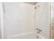 Crisp shower with a white subway tile surround, featuring classic design for an updated bathroom at 3051 W 39Th Ave, Denver, CO 80211