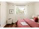 Comfortable bedroom with stylish decor, a view to the window, and lovely modern furnishings at 4420 W 27Th Ave, Denver, CO 80212